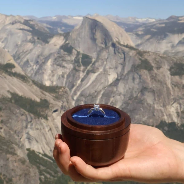 The engagement ring with Half Dome in the background